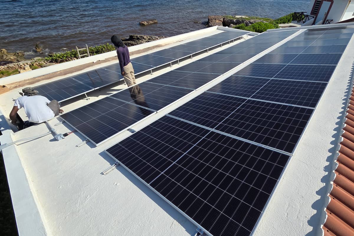 Rooftop solar array overlooking the Caribbean sea