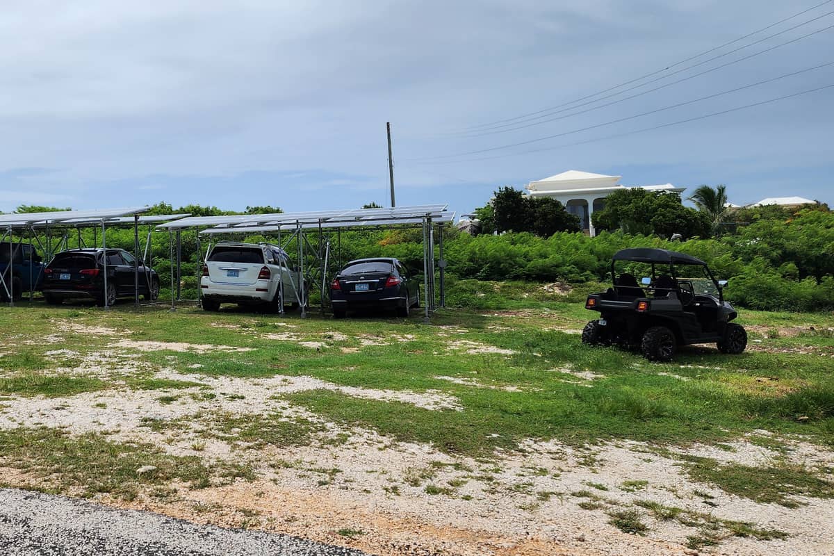 Wide view of a solar carport structure over a parking area